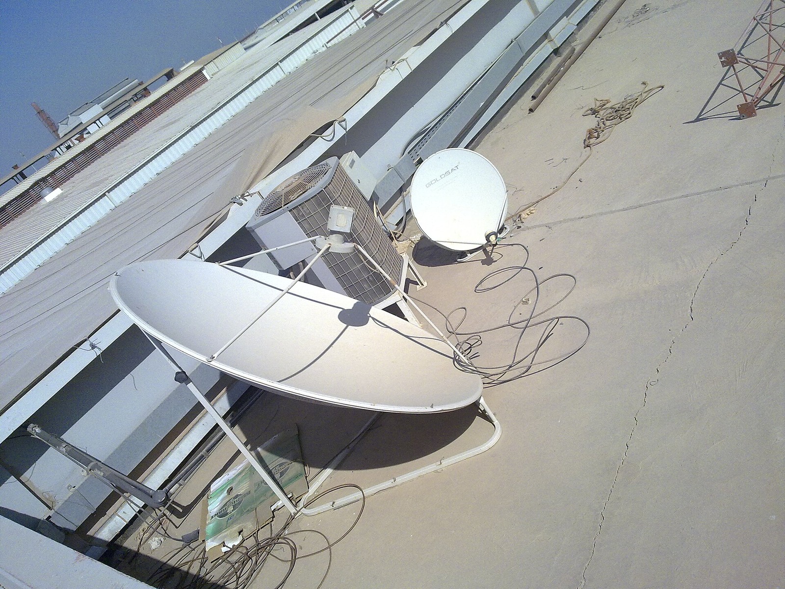 Satellite dish antenna pointing skyward for communications capacity
