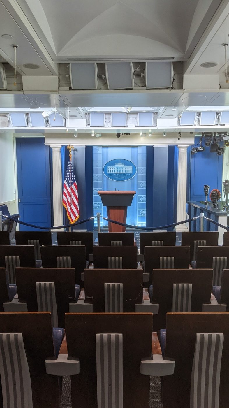 White House briefing room podium and cameras