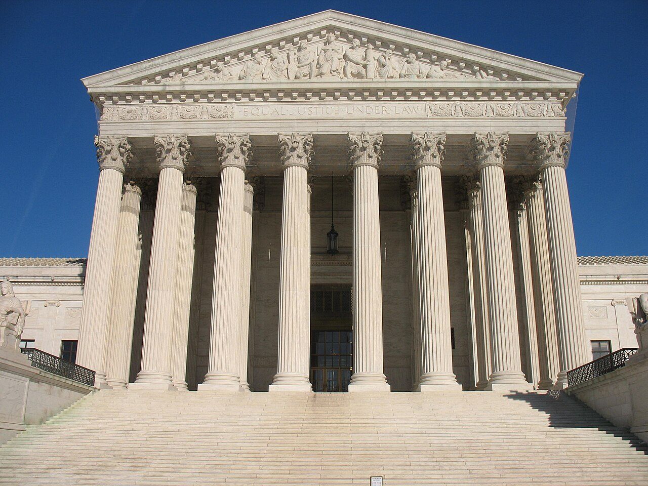 Supreme Court building facade under autumn sky