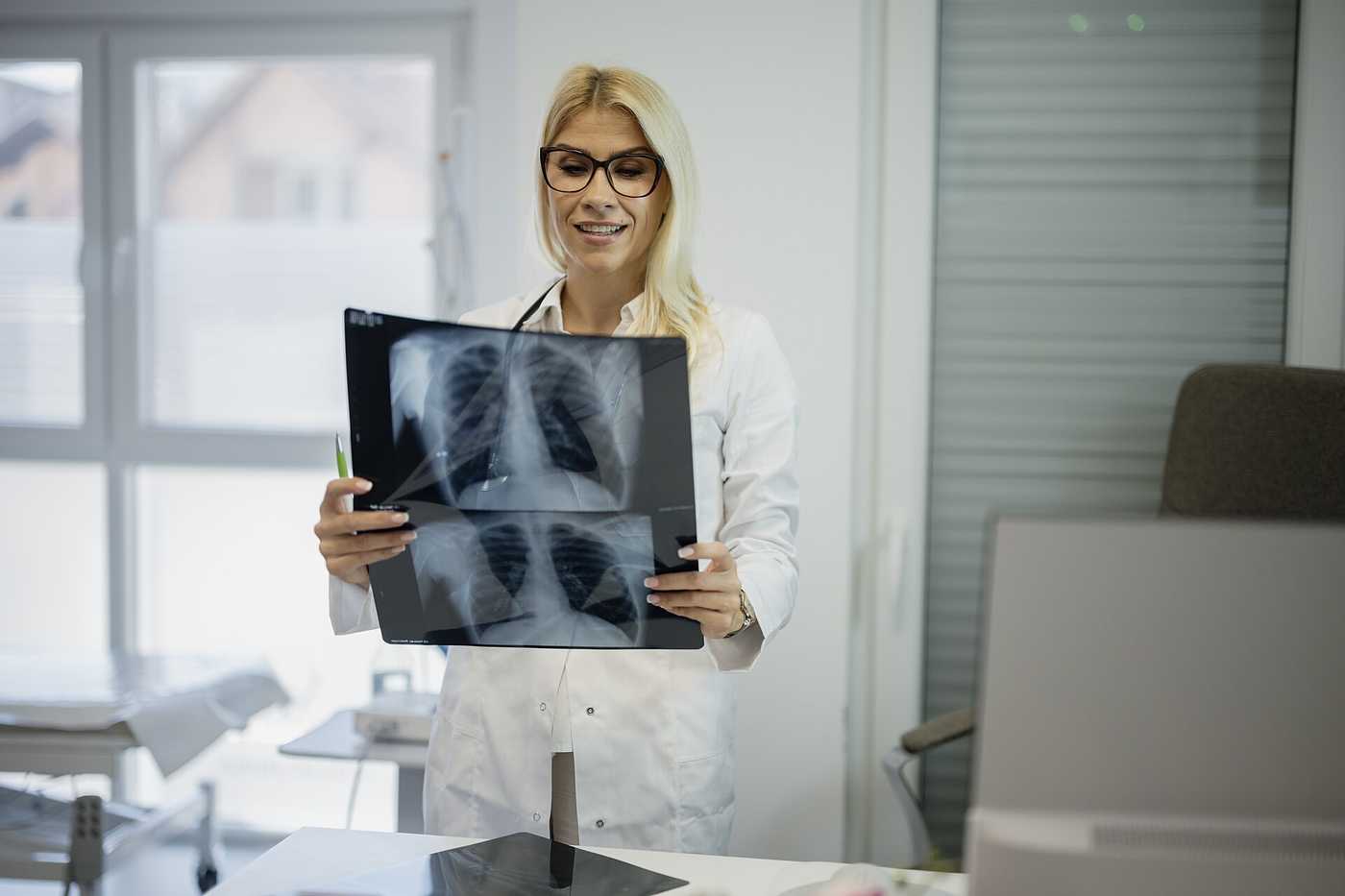 Clinician reviewing medical images in a clinic