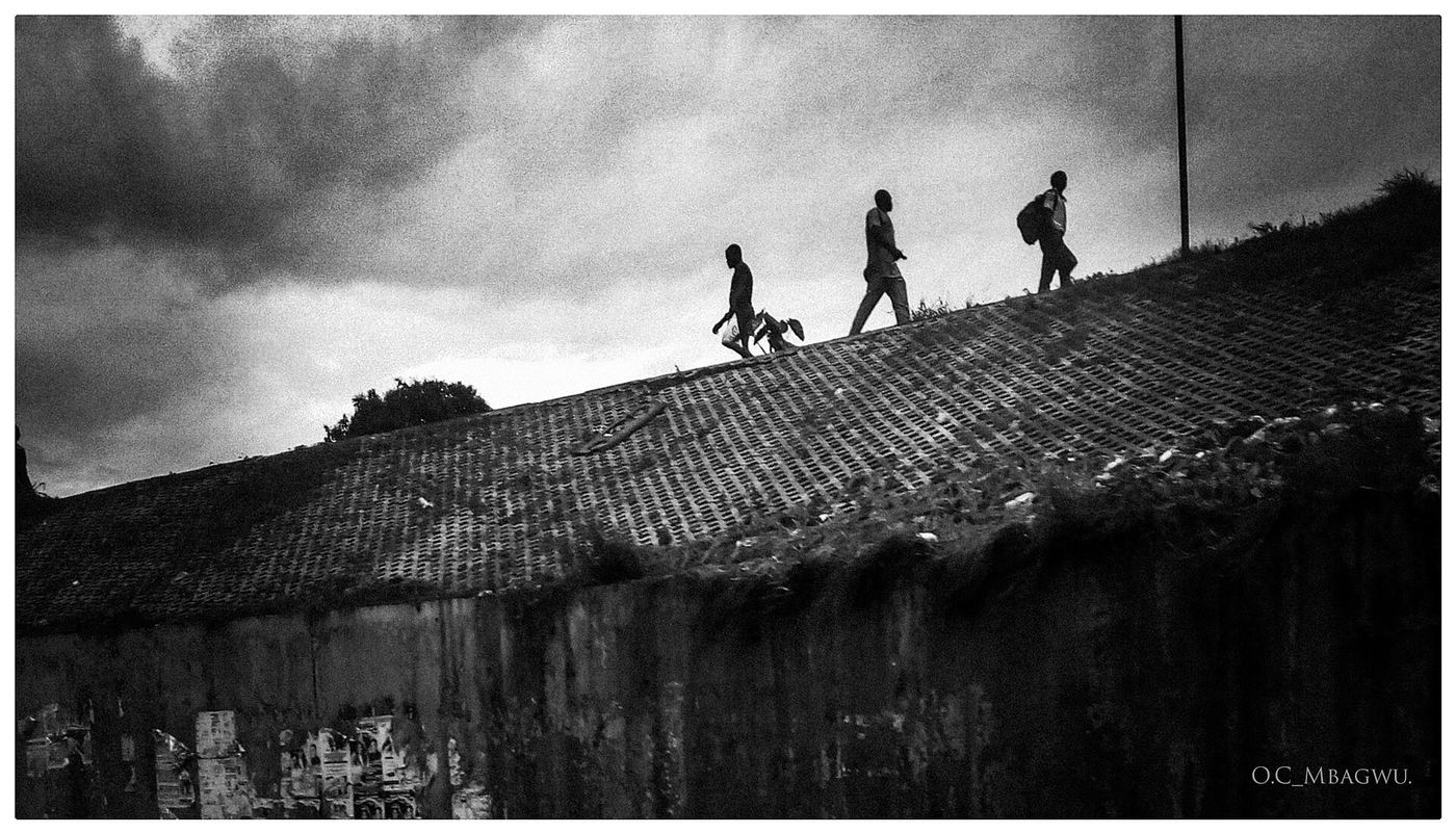 Pedestrians walking to work in the morning in Enugu, Nigeria