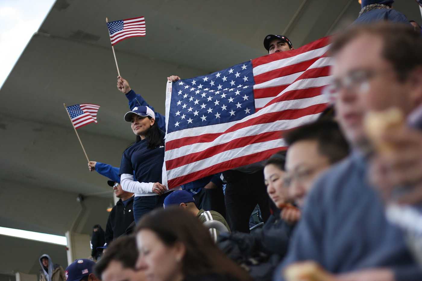 Baseball fans cheering in the stands