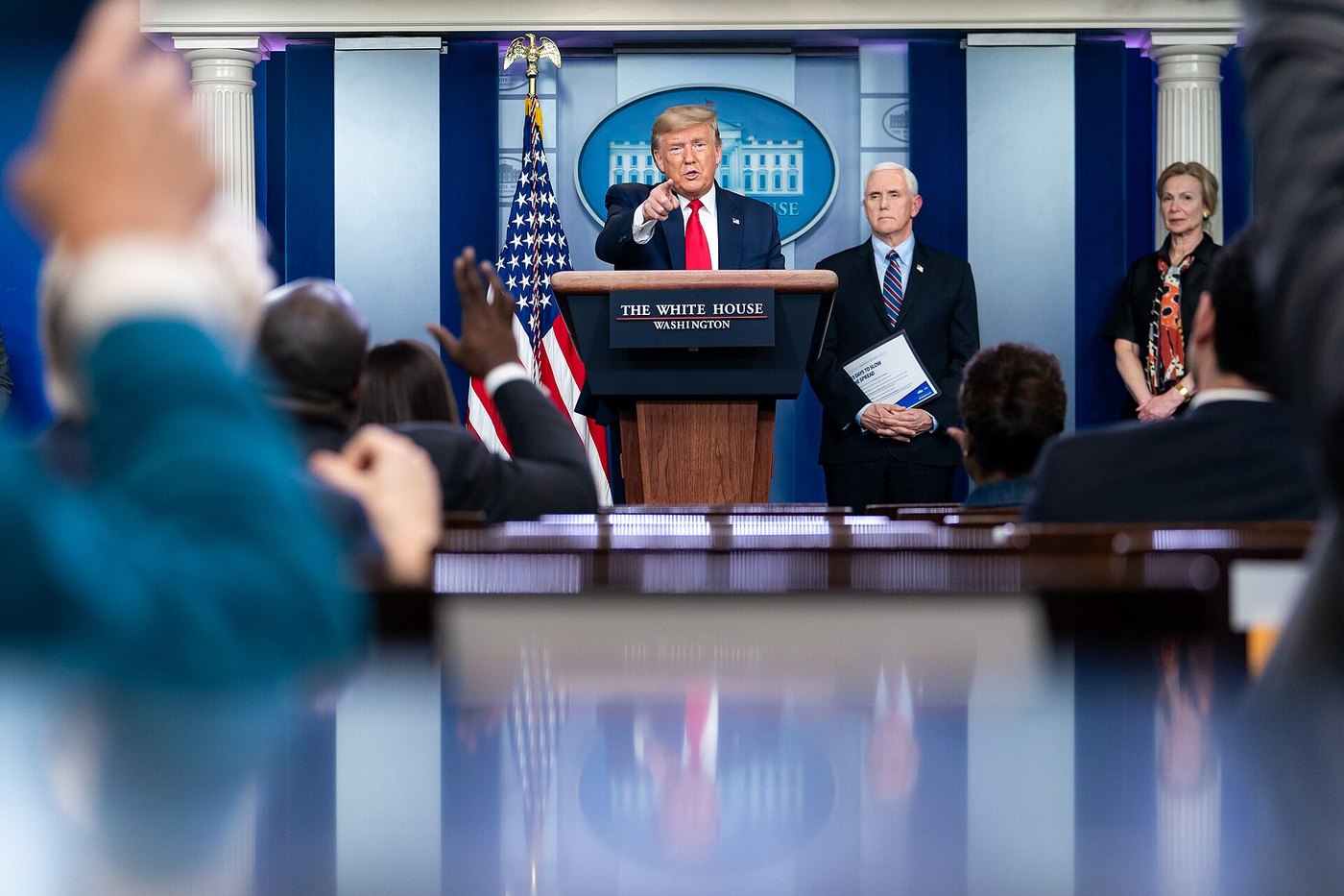 White House press briefing, with the president at the podium and reporters in front
