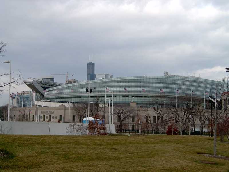 Front of Soldier Field in Chicago, glass bowl rising over the colonnade