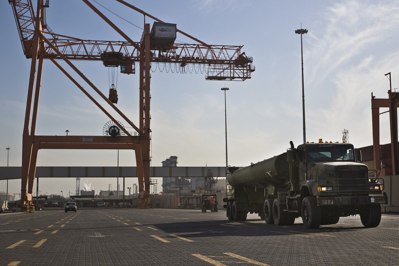 A U.S. Army truck prepares to load onto a ship at the Port of Shuaiba, Kuwait, in 2017