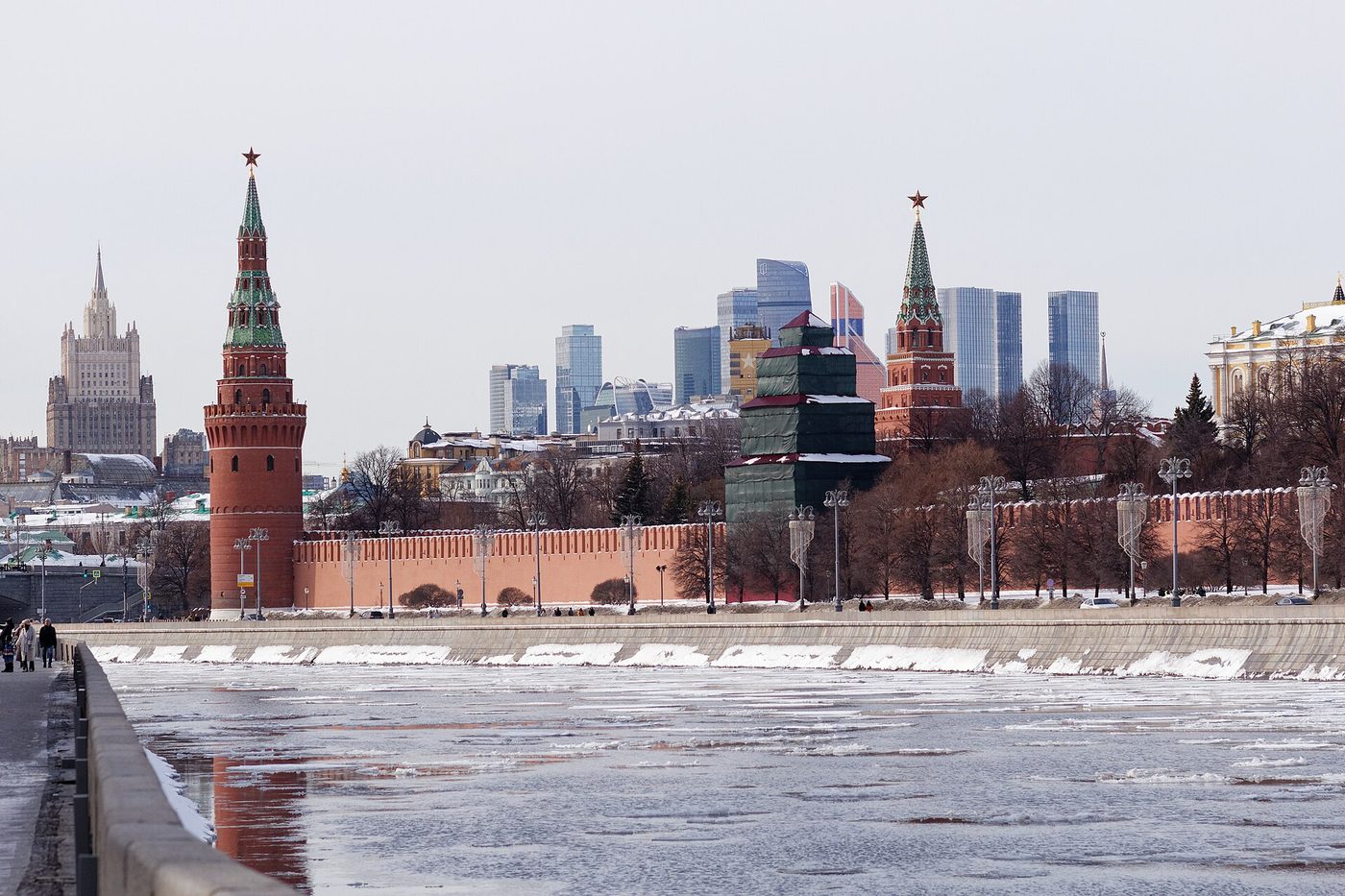 Moscow business-district towers rise behind the Kremlin after a snowfall in February 2026