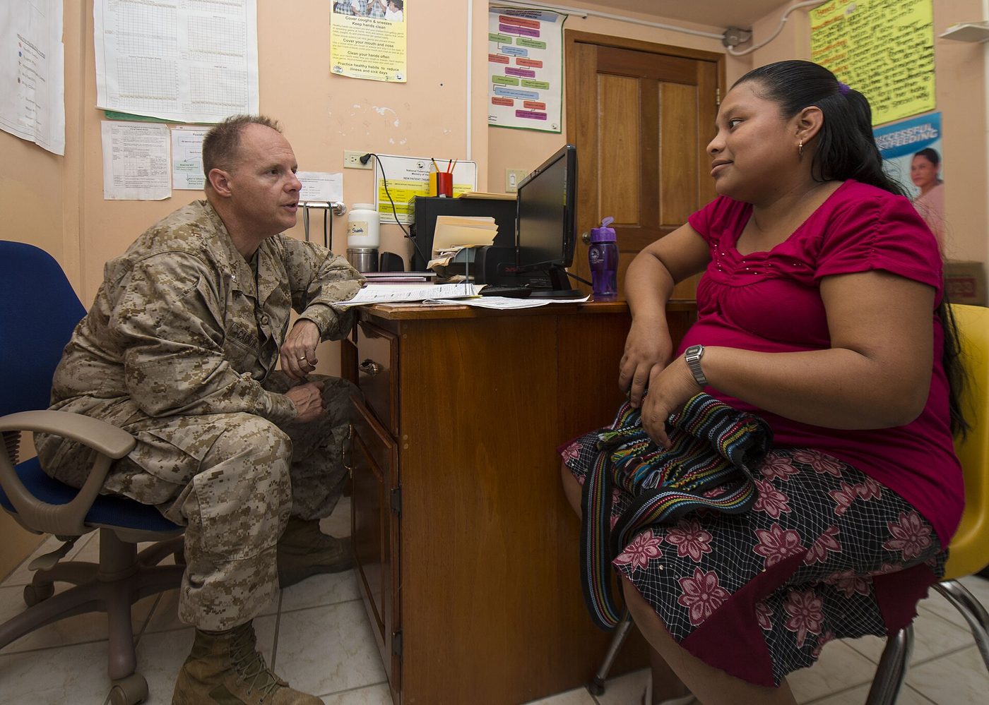 A U.S. Navy doctor gives a pregnant patient a prenatal checkup at a clinic in Belize in 2014