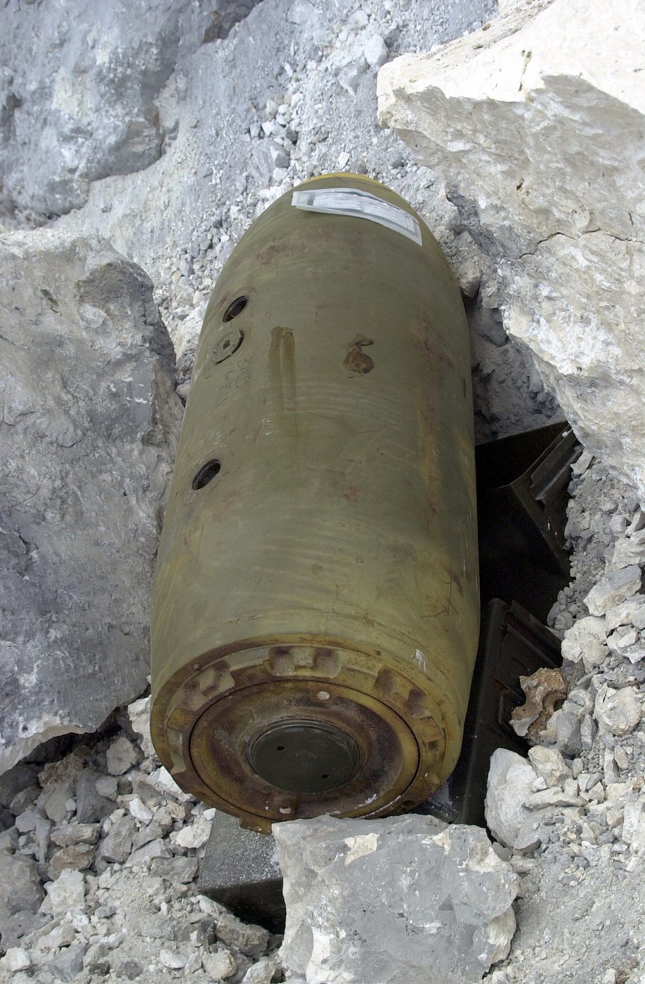 An old 750-pound bomb set for controlled detonation during Air Force explosive ordnance disposal training on Tarague Beach, Andersen Air Force Base, Guam, in 2002