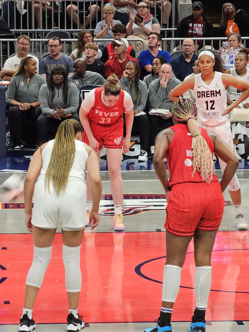 Atlanta Dream and Indiana Fever players line up for a free throw in June 2024