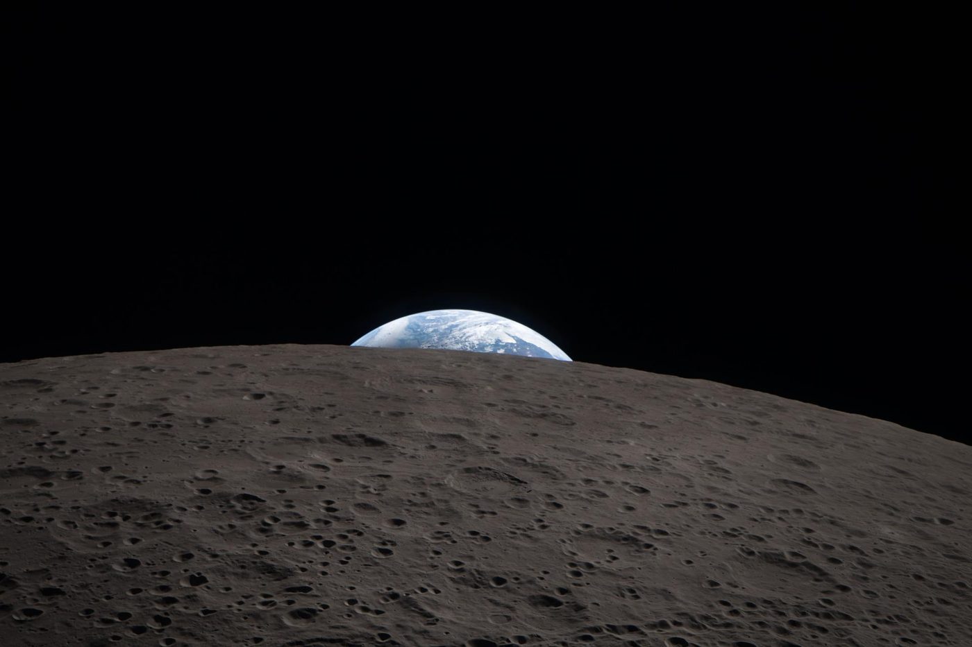 Earth setting behind the Moon's horizon, photographed by the Artemis II crew