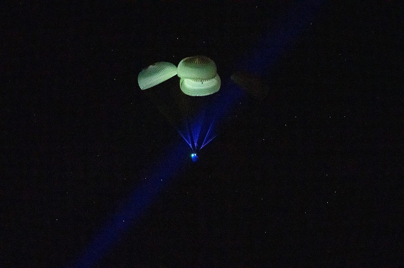 SpaceX's Dragon Endurance descends under parachutes before splashing down with NASA's Crew-5 astronauts in March 2023