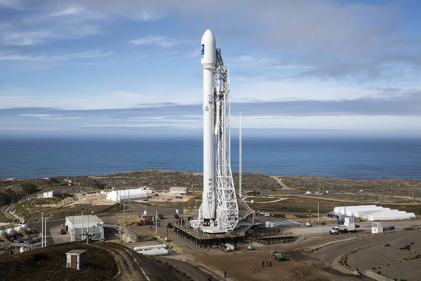 A SpaceX Falcon 9 rocket stands vertical at Vandenberg Air Force Base in 2016