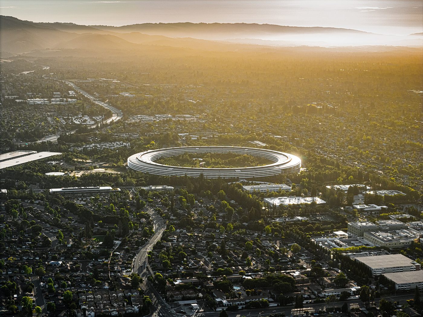 Aerial view of Apple Park in Cupertino, California, at sunset in June 2024