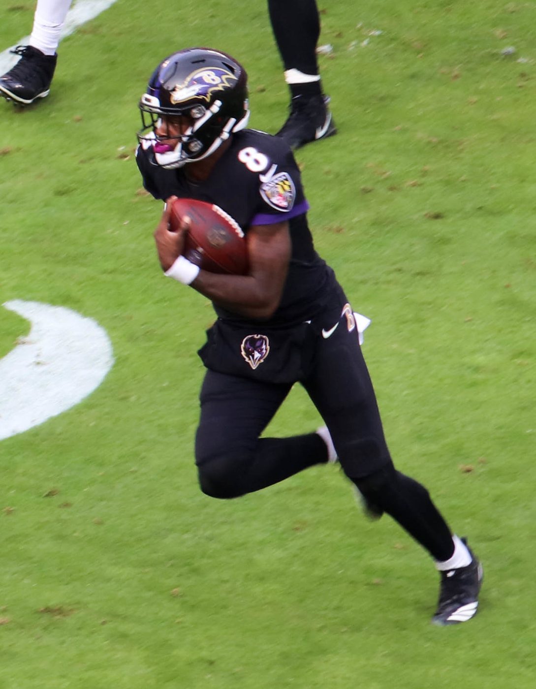 Baltimore Ravens quarterback Lamar Jackson runs the ball against the Cincinnati Bengals in 2018