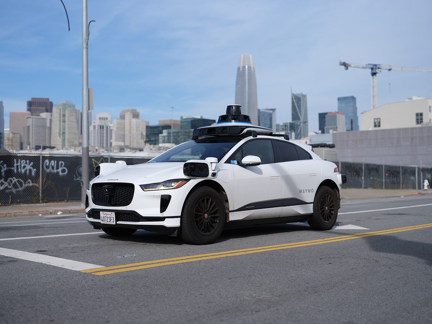 A driverless Waymo Jaguar I-Pace operating in San Francisco in 2023