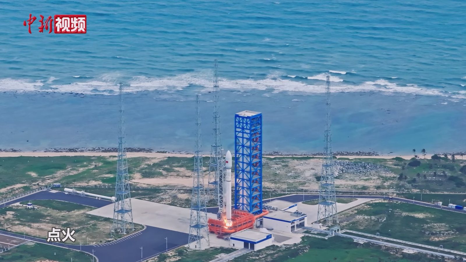 A Long March 12 rocket at ignition on its pad at Wenchang, China