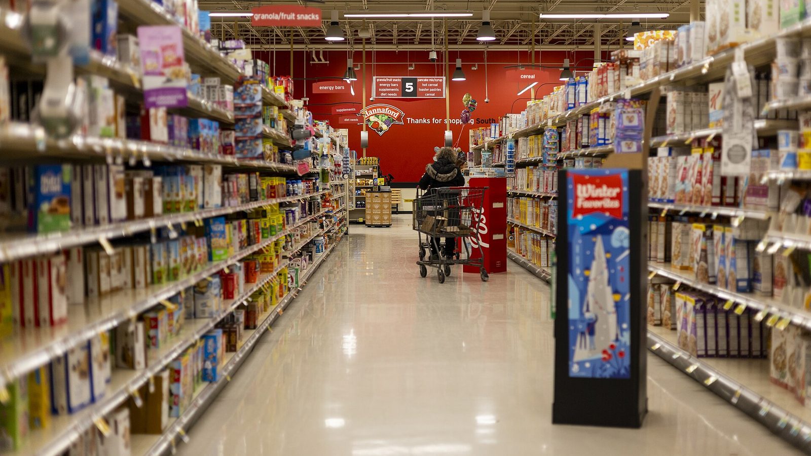 Grocery store aisle stocked with food