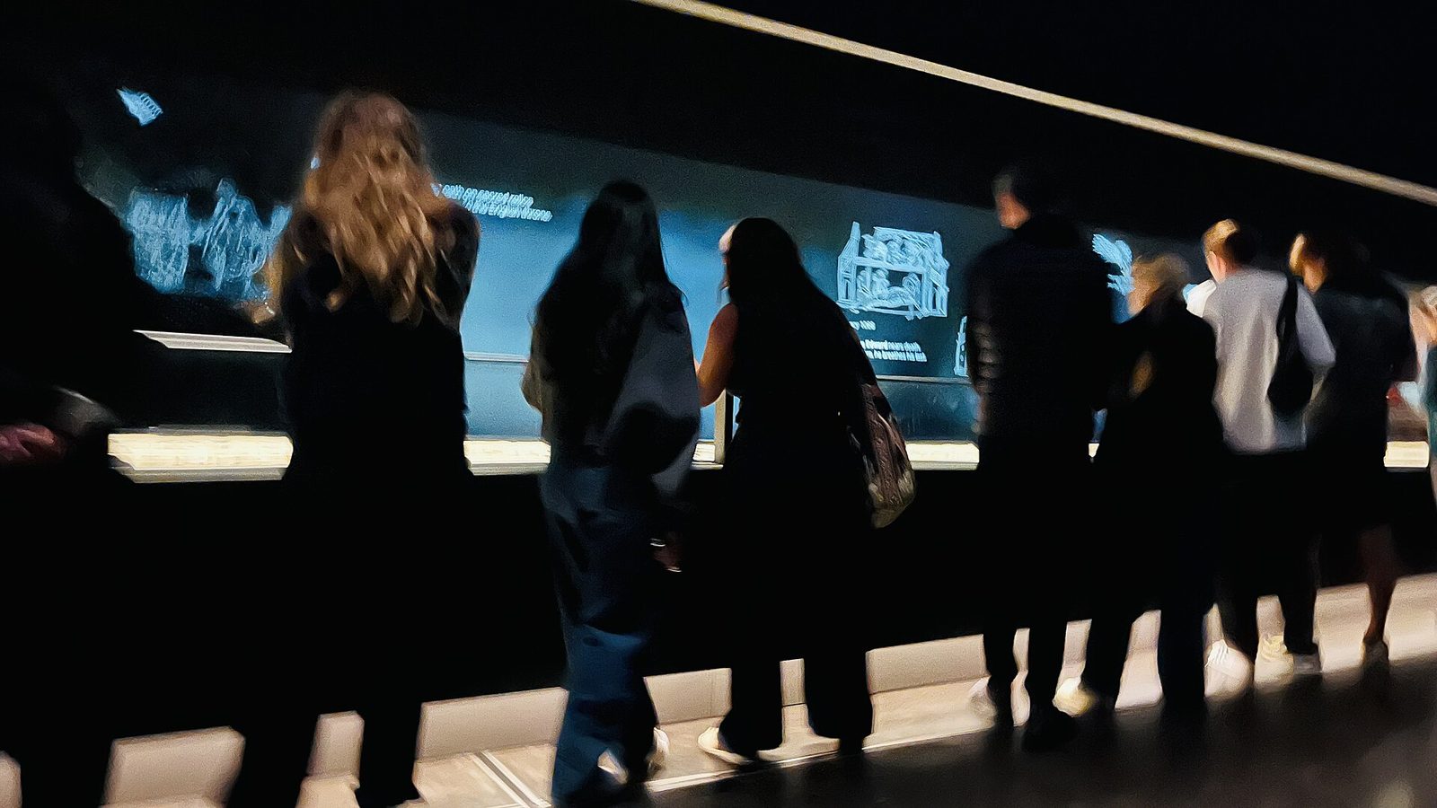 Visitors view the Bayeux Tapestry exhibition at the British Museum in London