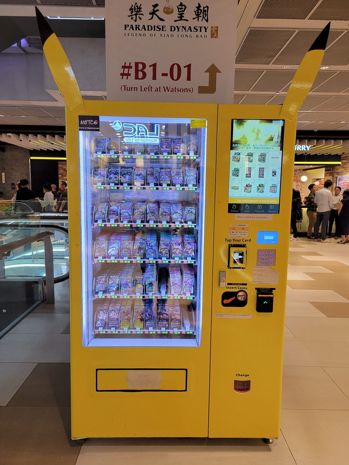 Vending machine in Singapore selling packs of Pokemon and One Piece trading cards