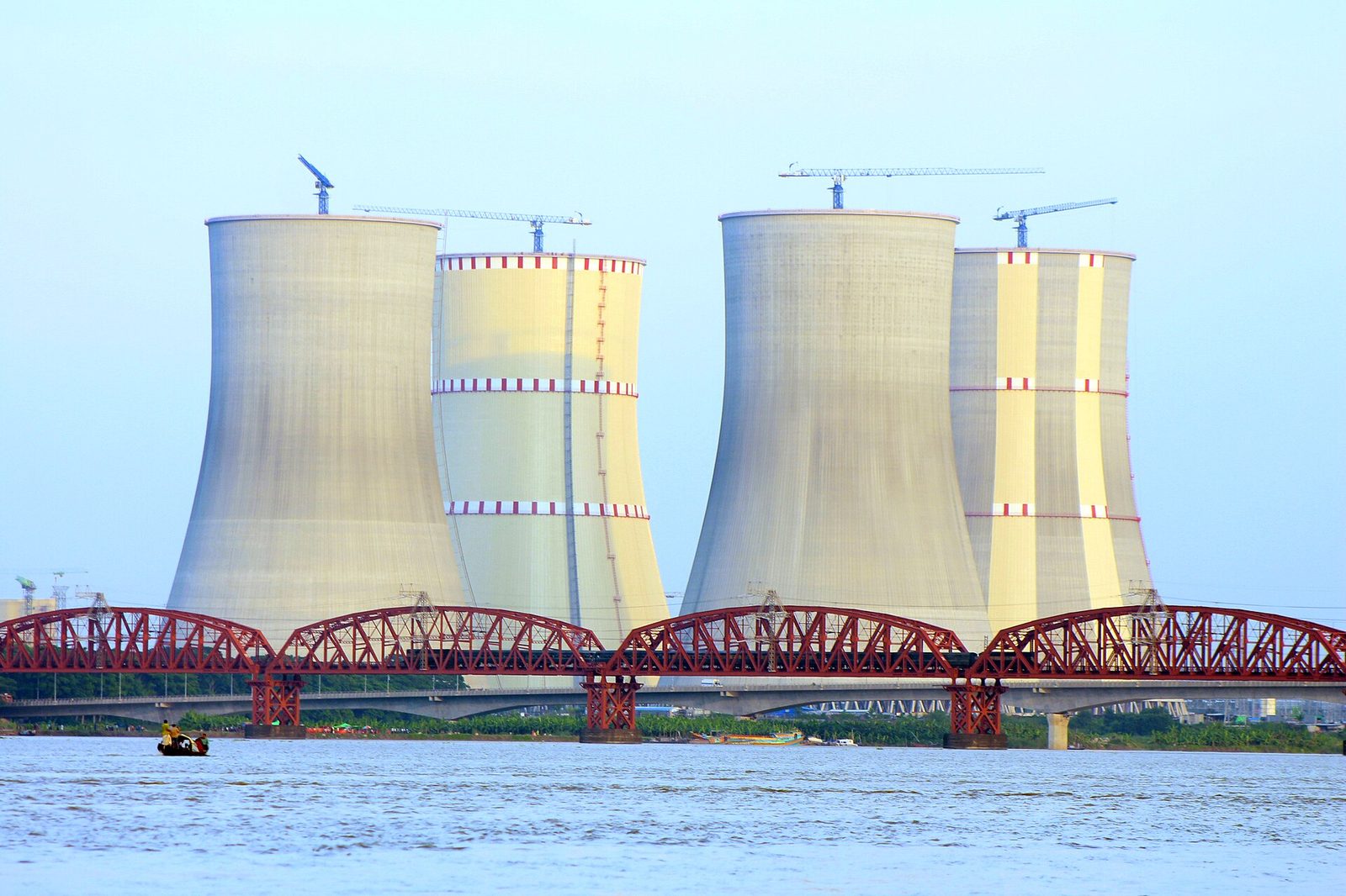 Cooling towers of Bangladesh's Rooppur Nuclear Power Plant rise behind the Hardinge Bridge over the Padma River (2023 file photo)
