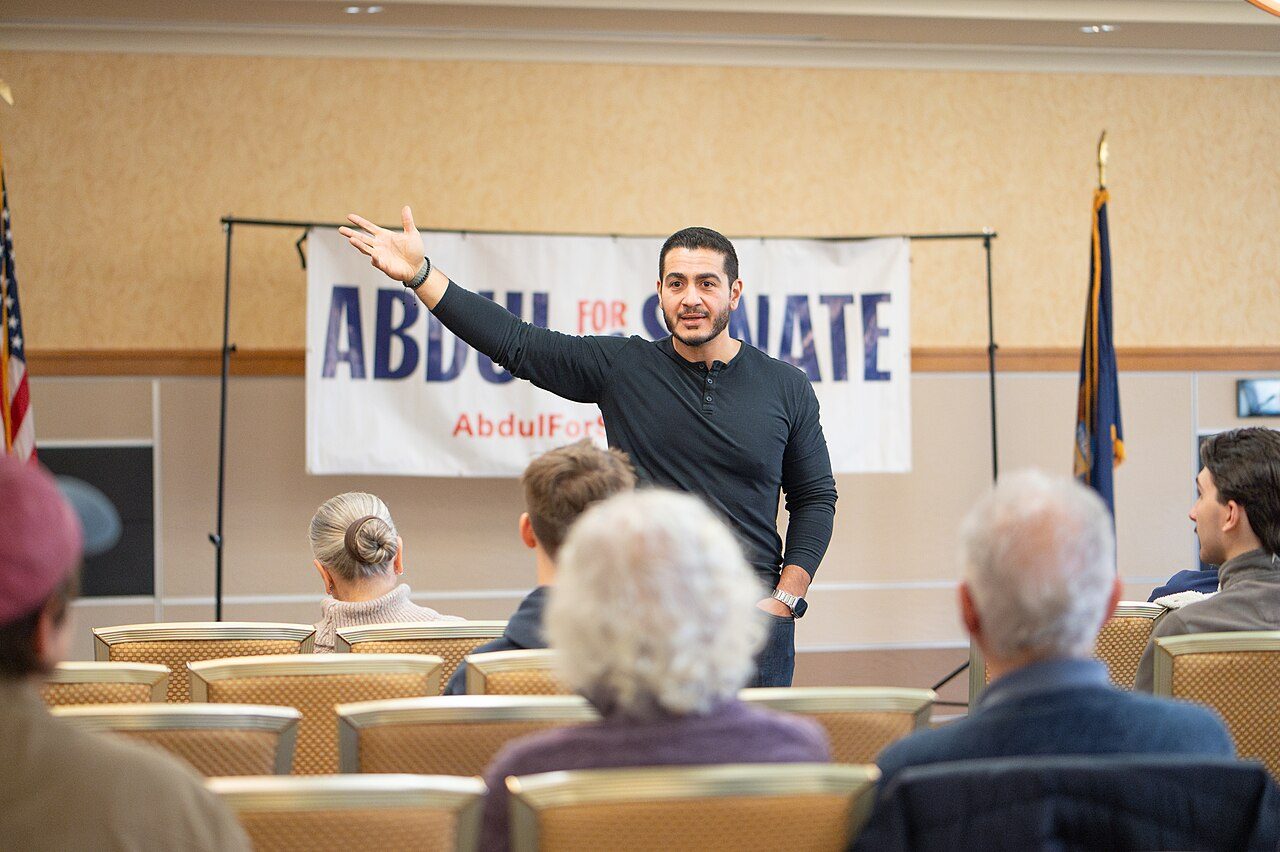 Abdul El-Sayed speaking with supporters at a campaign meet-and-greet in Michigan