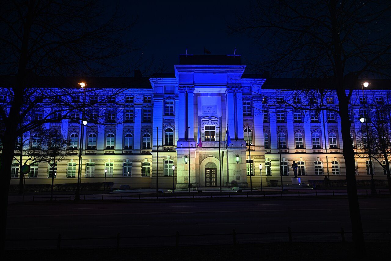 The Chancellery of the Prime Minister in Warsaw, lit with a projection of Ukraine's flag