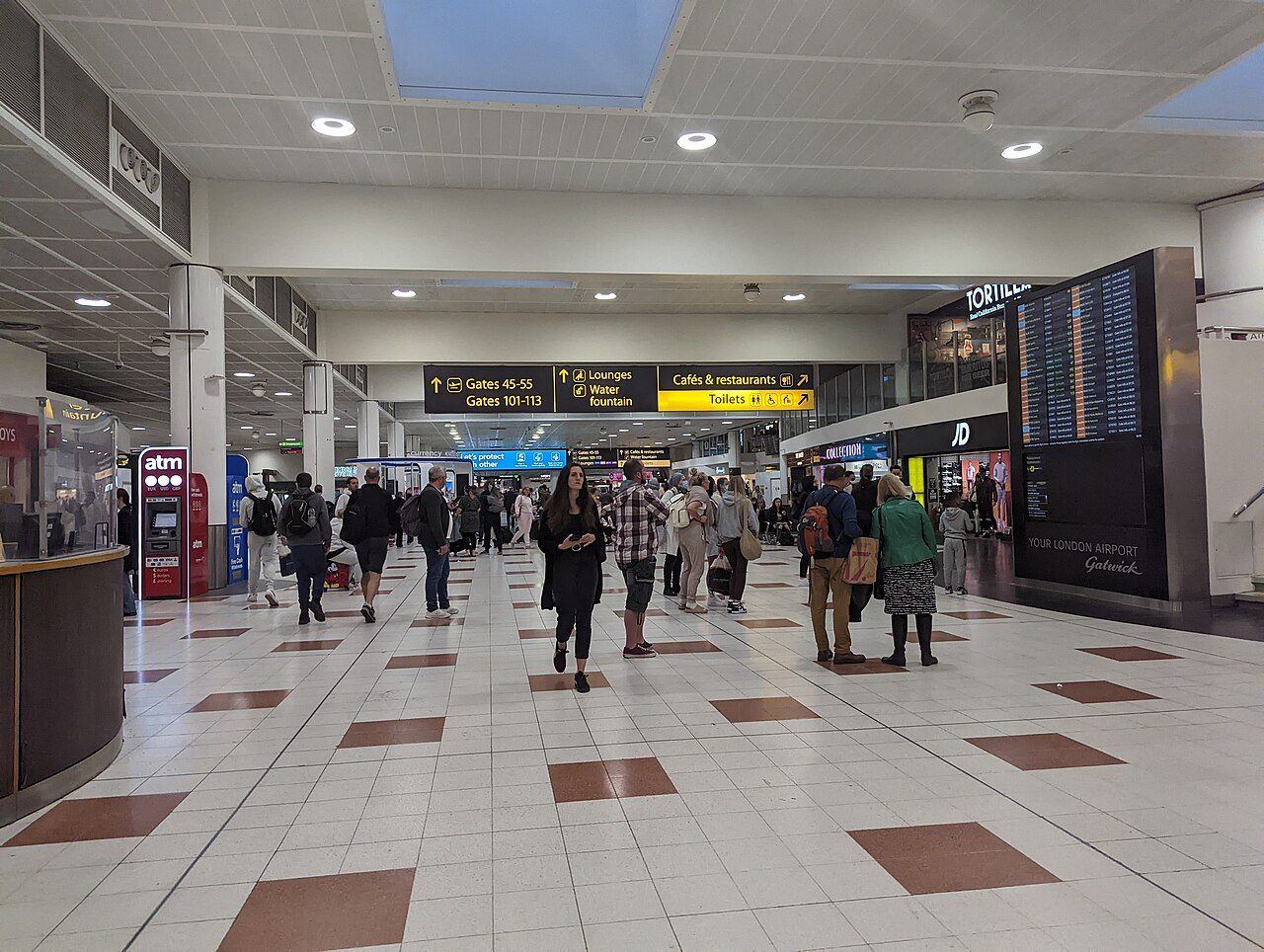 Travellers in the departures hall of Gatwick Airport's North Terminal