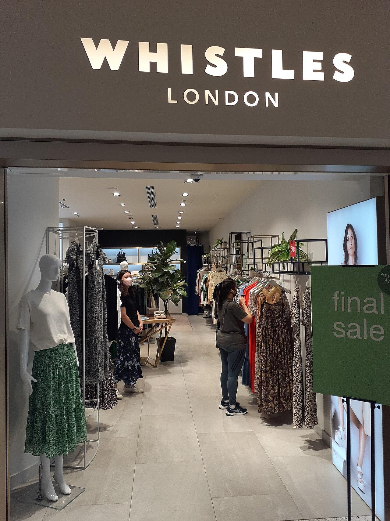 The front of a Whistles clothing shop inside a shopping mall
