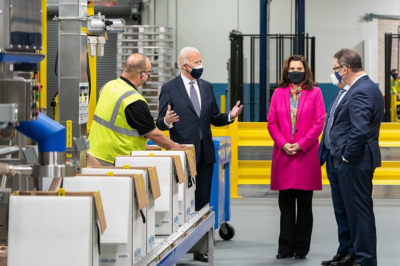 People touring a Pfizer manufacturing facility