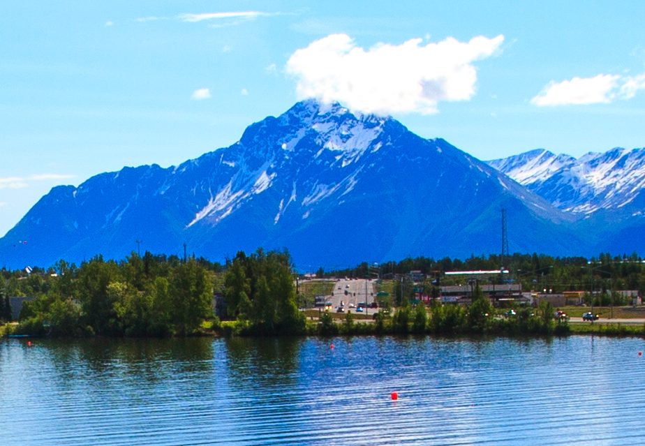 Wasilla's lakeshore and commercial district with mountains behind