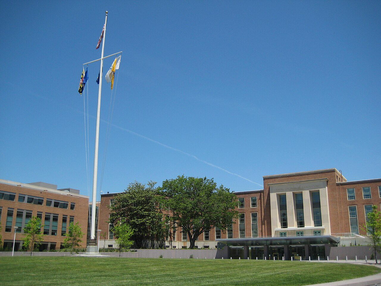 Two connected buildings with a flagpole on the FDA campus in White Oak, Maryland
