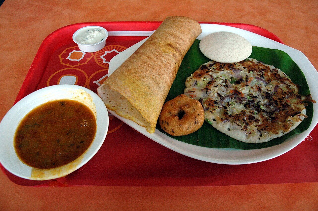 A South Indian meal of dosa, idli and vada on a tray