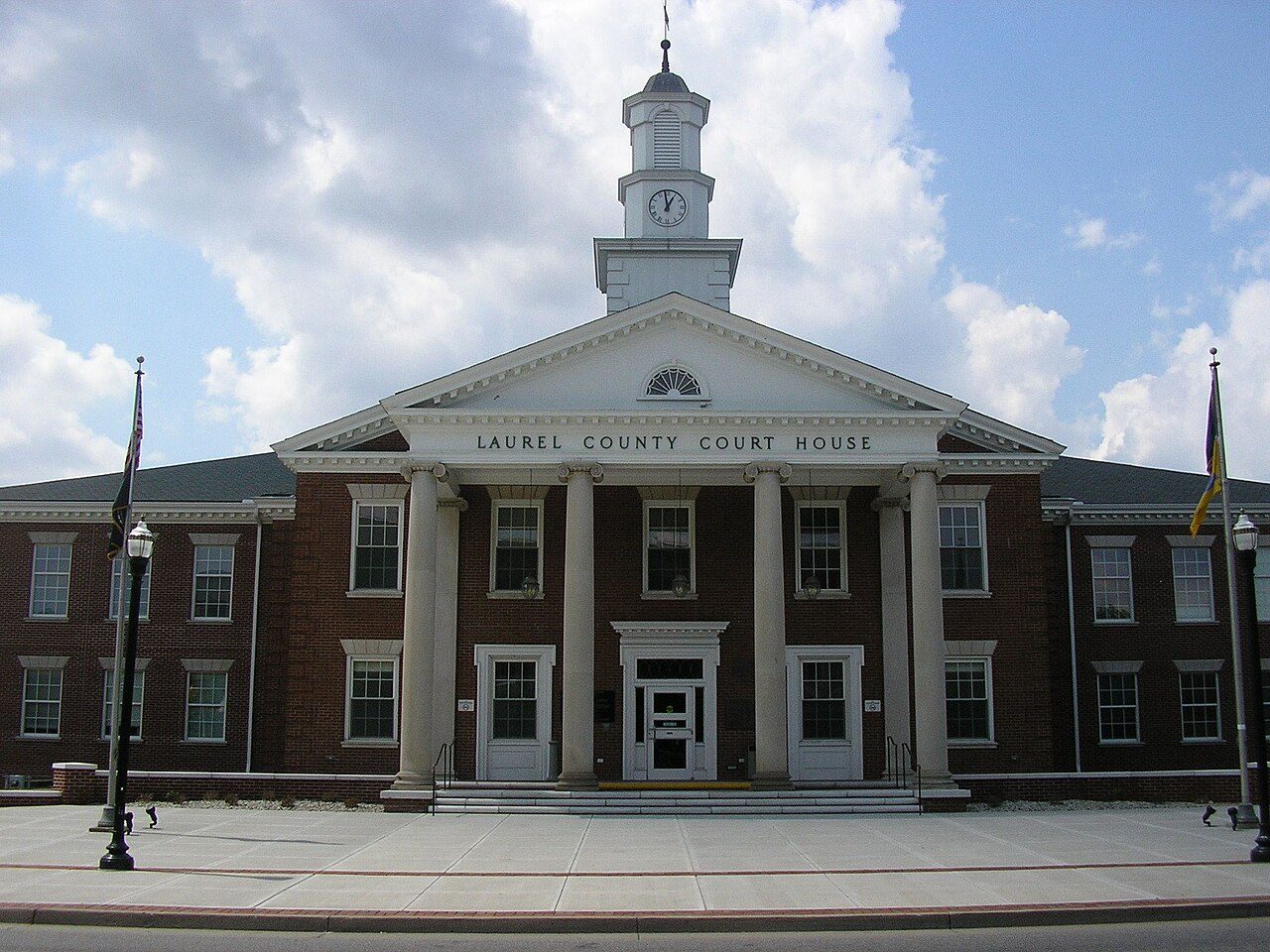 The Laurel County Courthouse, a brick building with a white cupola, in London, Kentucky