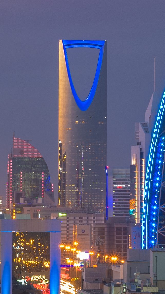 The Kingdom Centre tower lit up at dusk in Riyadh's skyline