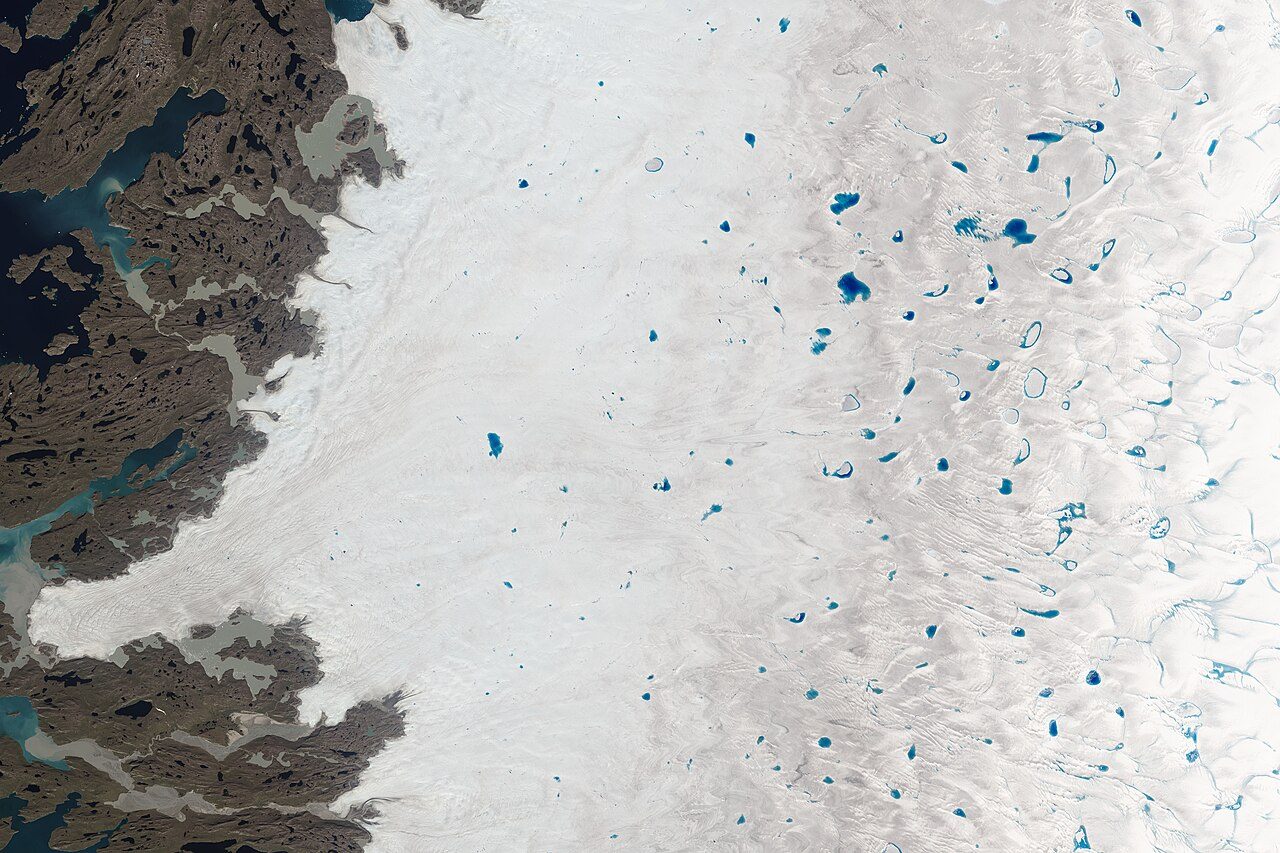 Blue meltwater lakes on the surface of the Greenland Ice Sheet, seen from above