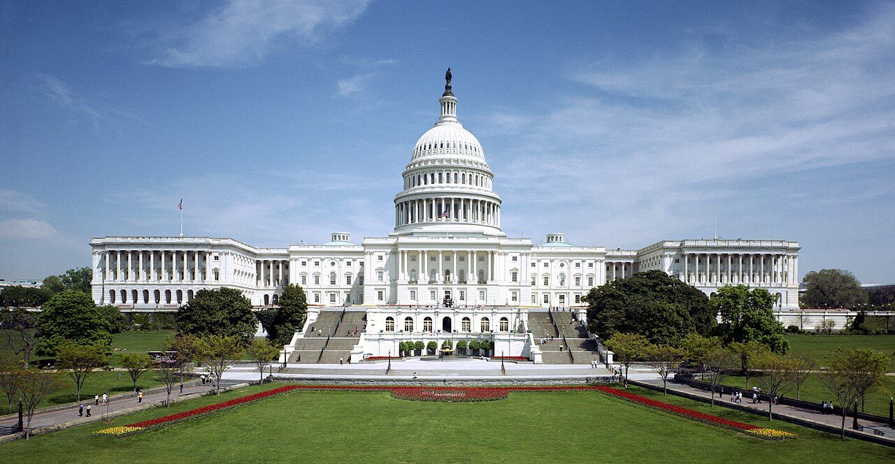 The west front of the U.S. Capitol under a blue sky