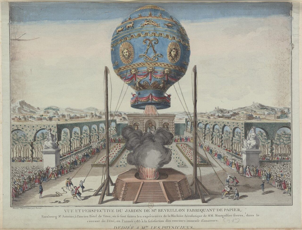 A hand-colored engraving of a blue and gold hot-air balloon held by ropes above a smoking fire platform, with crowds lining a walled garden