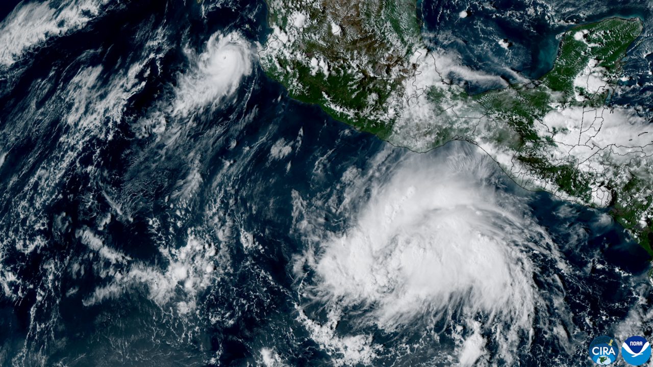 Satellite image of compact Hurricane Simon, upper left, and the larger Tropical Storm Trudy off Mexico's Pacific coast on Oct. 13