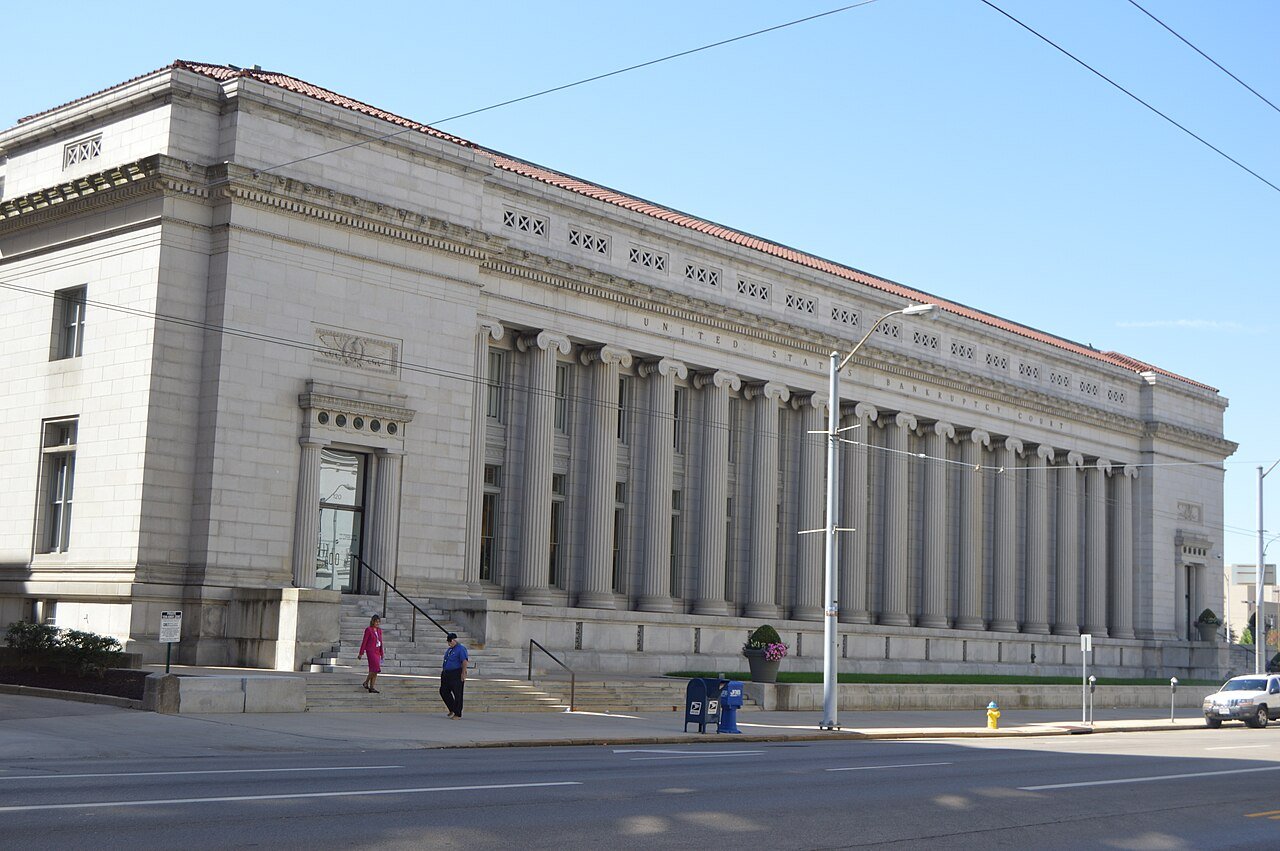 The columned stone front of the U.S. Bankruptcy Courthouse in downtown Dayton, Ohio, on a sunny day