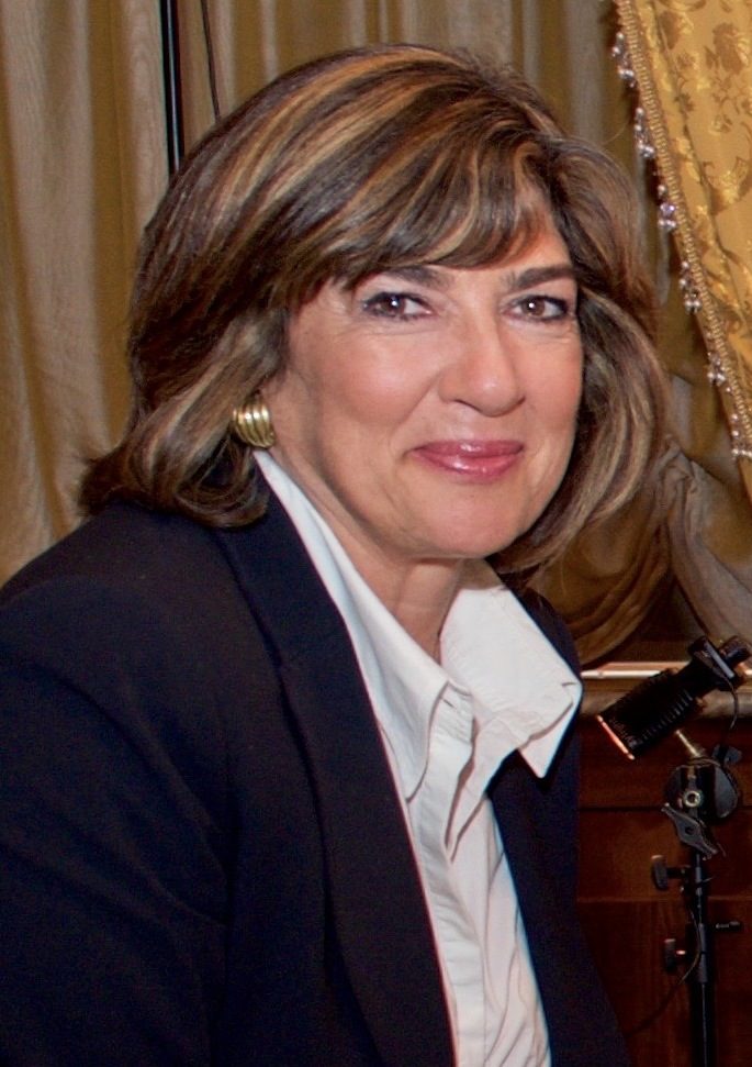 Christiane Amanpour seated for an interview in Vienna