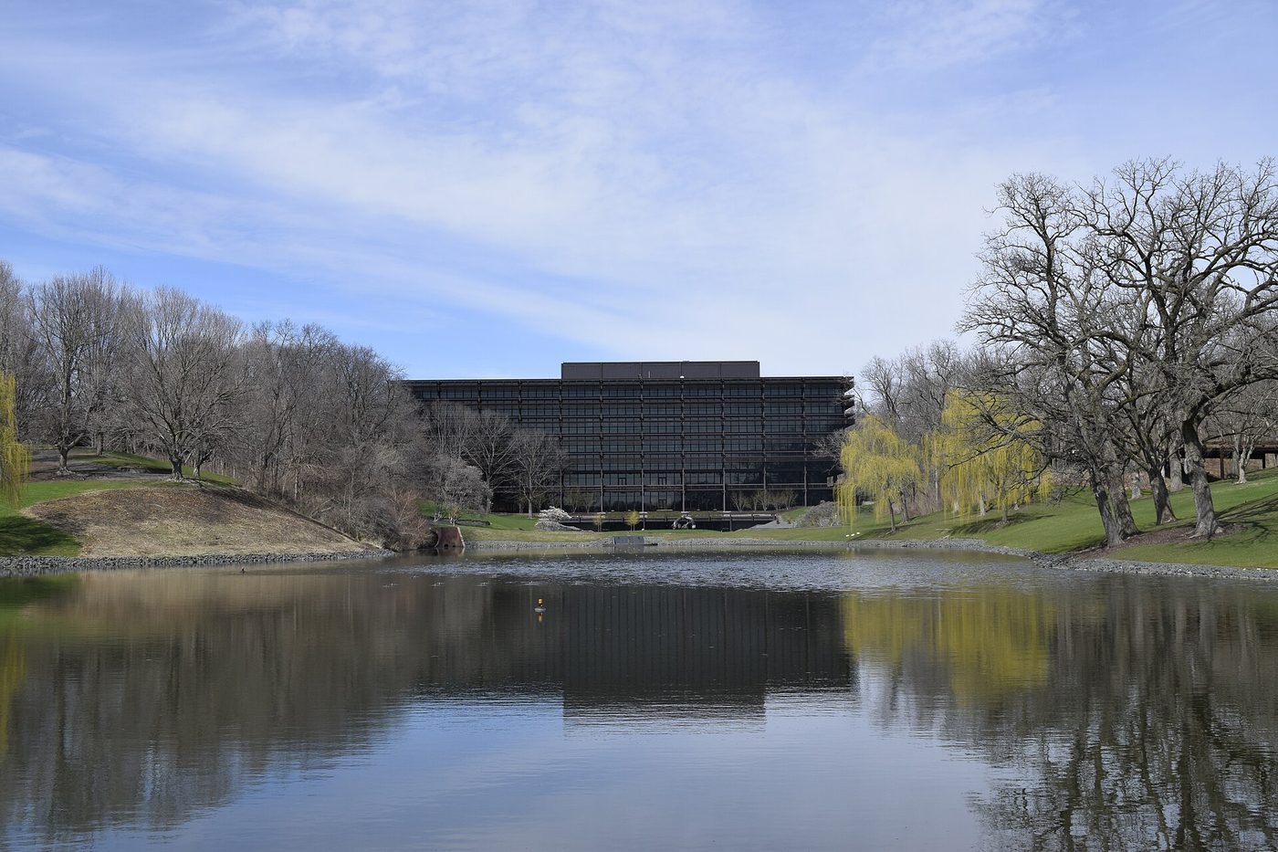 John Deere World Headquarters building seen across a pond