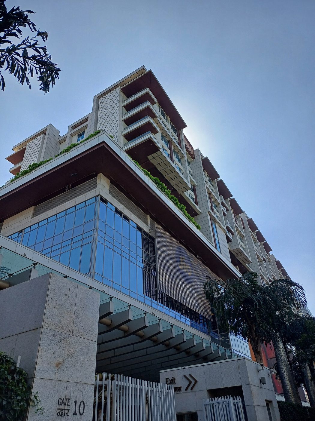 The curved glass facade of the Jio World Centre in Mumbai