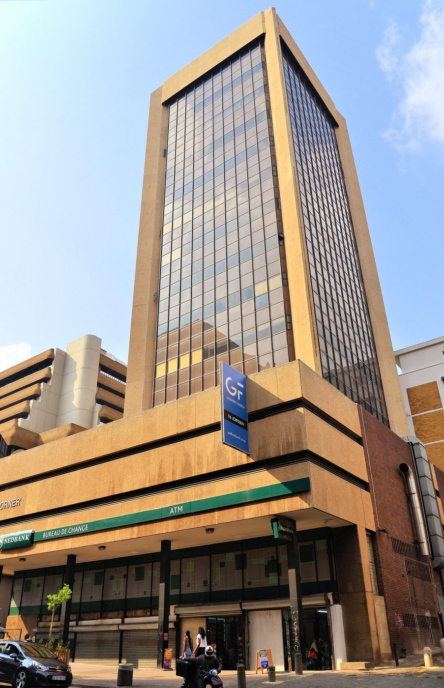 A Nedbank-branded corner building on a city street in Johannesburg