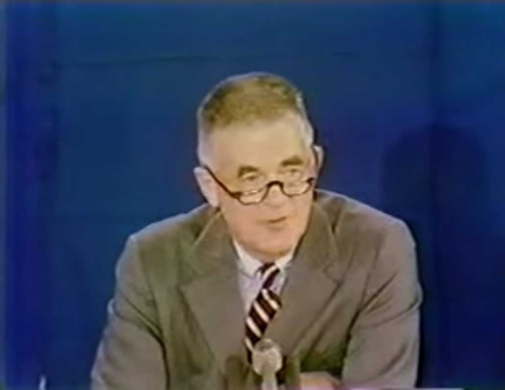 Black-and-white image of Archibald Cox speaking at the National Press Club