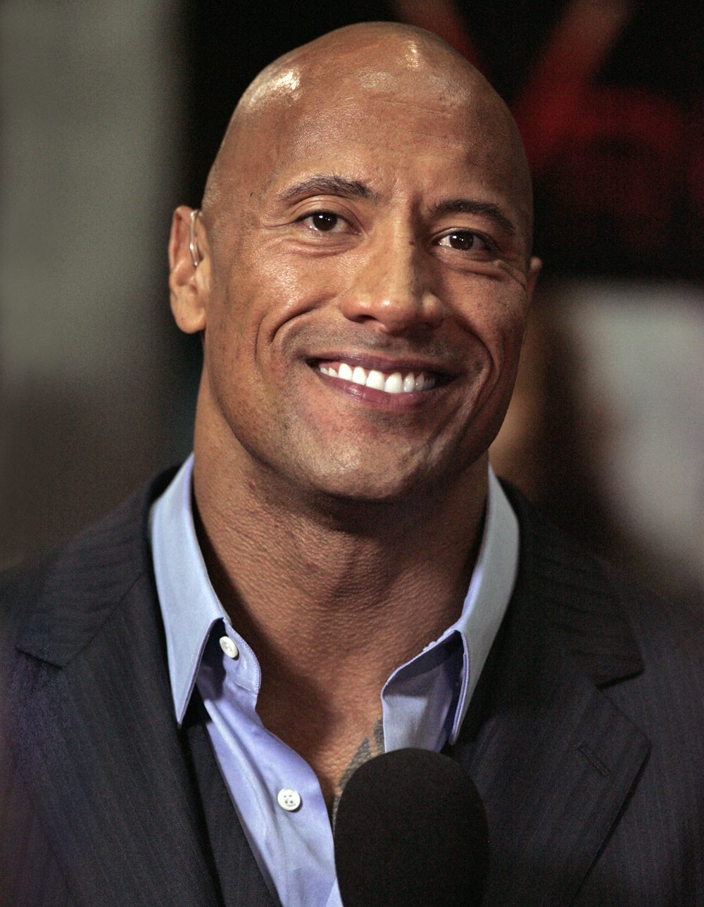 Dwayne Johnson smiling at a public event