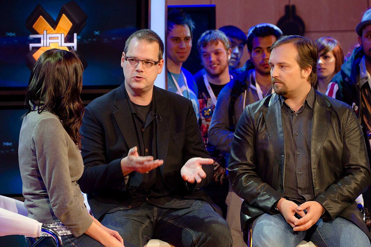 BioWare founders Ray Muzyka and Greg Zeschuk seated during a televised interview