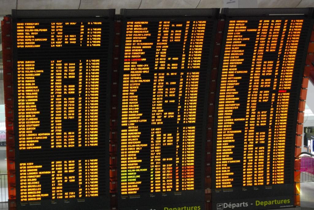 A departures board at Paris Charles de Gaulle Airport