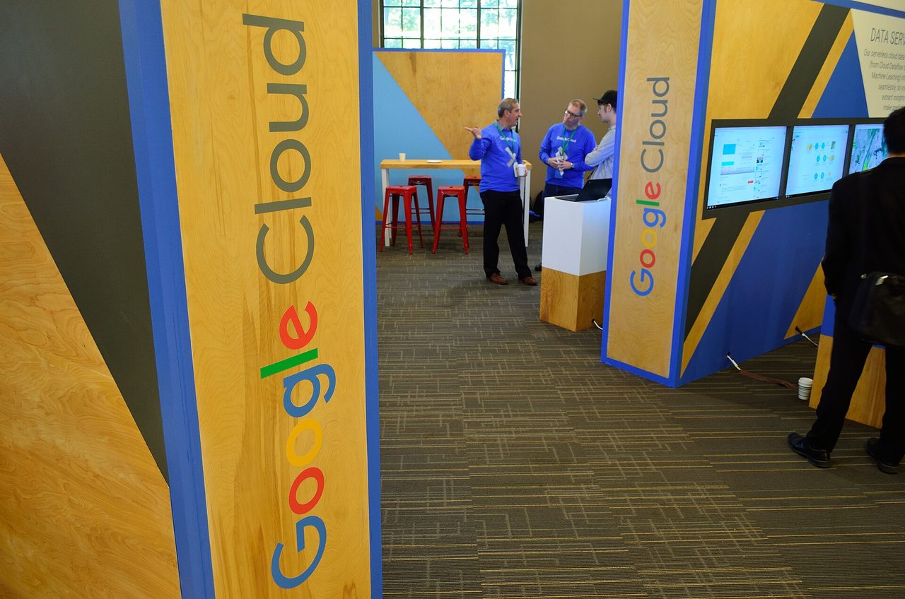 Google Cloud signs on display booths at a Google Cloud event