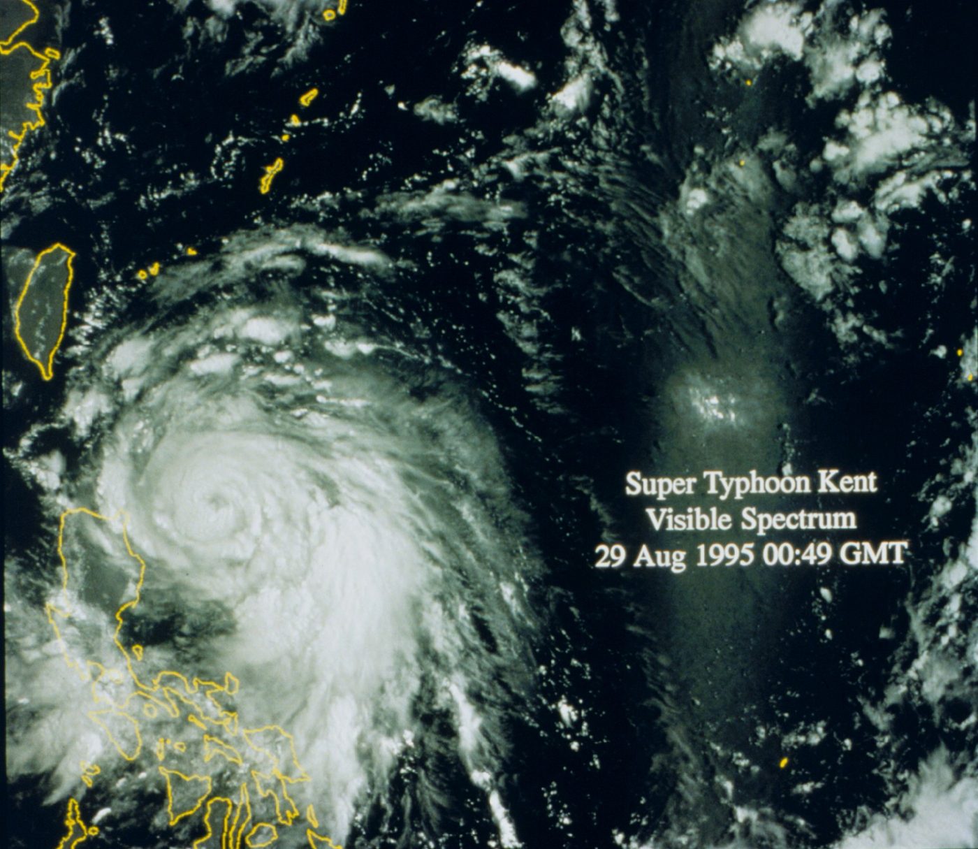 Satellite image of a large typhoon with a clear eye east of Luzon