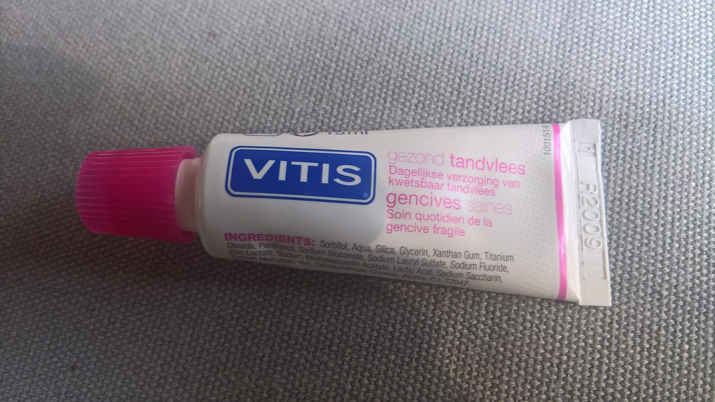 A tube of toothpaste on a bathroom counter